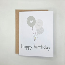 Happy birthday card with gray balloons, heart, star, and gem accent