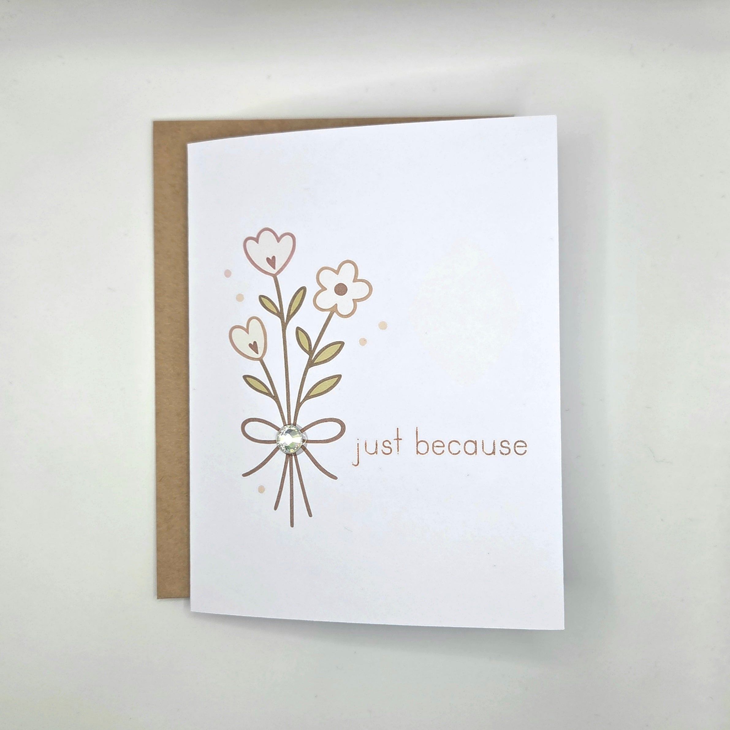 Handmade greeting card with floral design and 'just because' text, perfect for cozy gifts