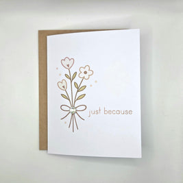 Handmade greeting card with floral design and 'just because' text, perfect for cozy gifts