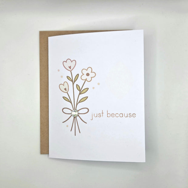 Handmade greeting card with floral design and 'just because' text, perfect for cozy gifts