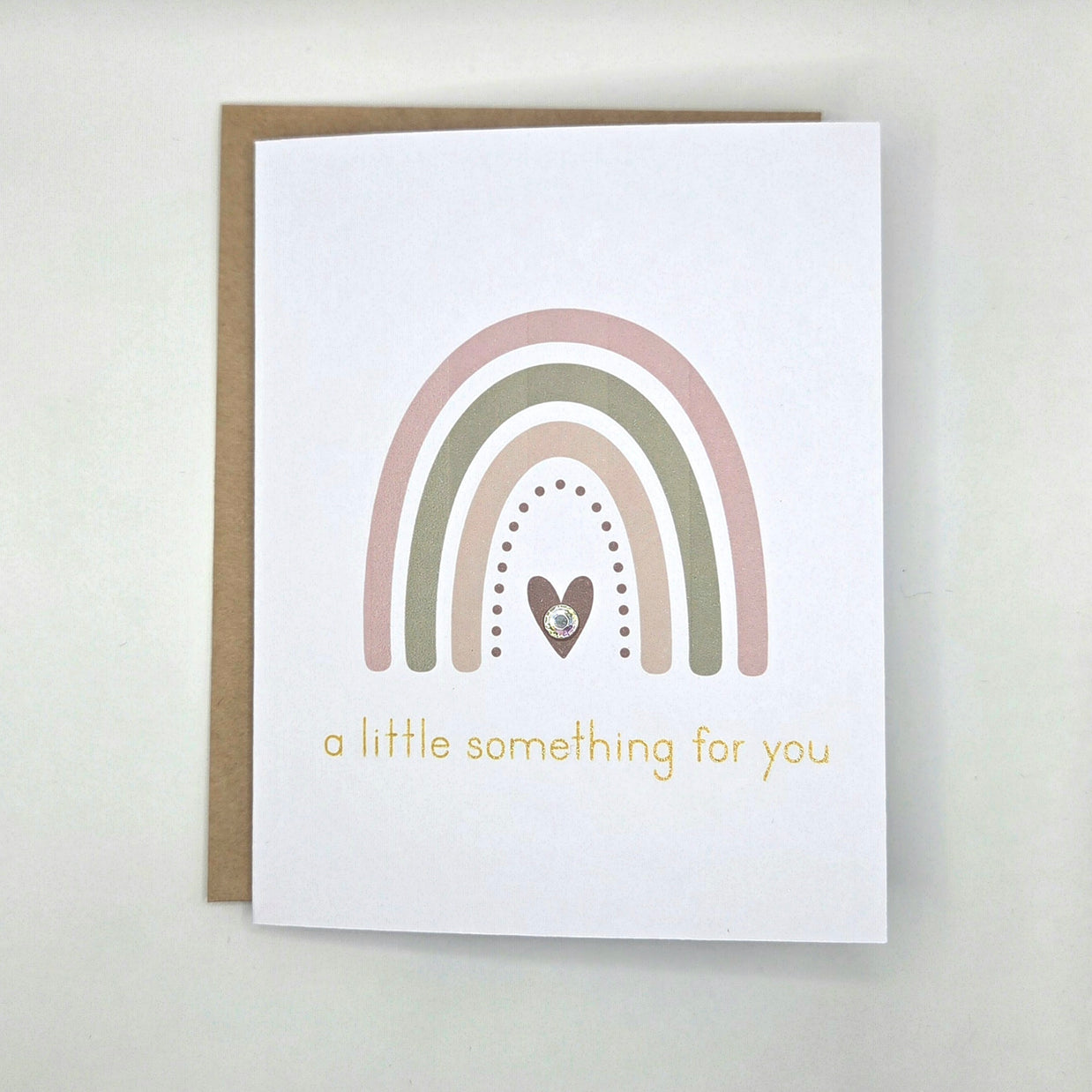 Rainbow card with heart and gold text 'a little something for you'