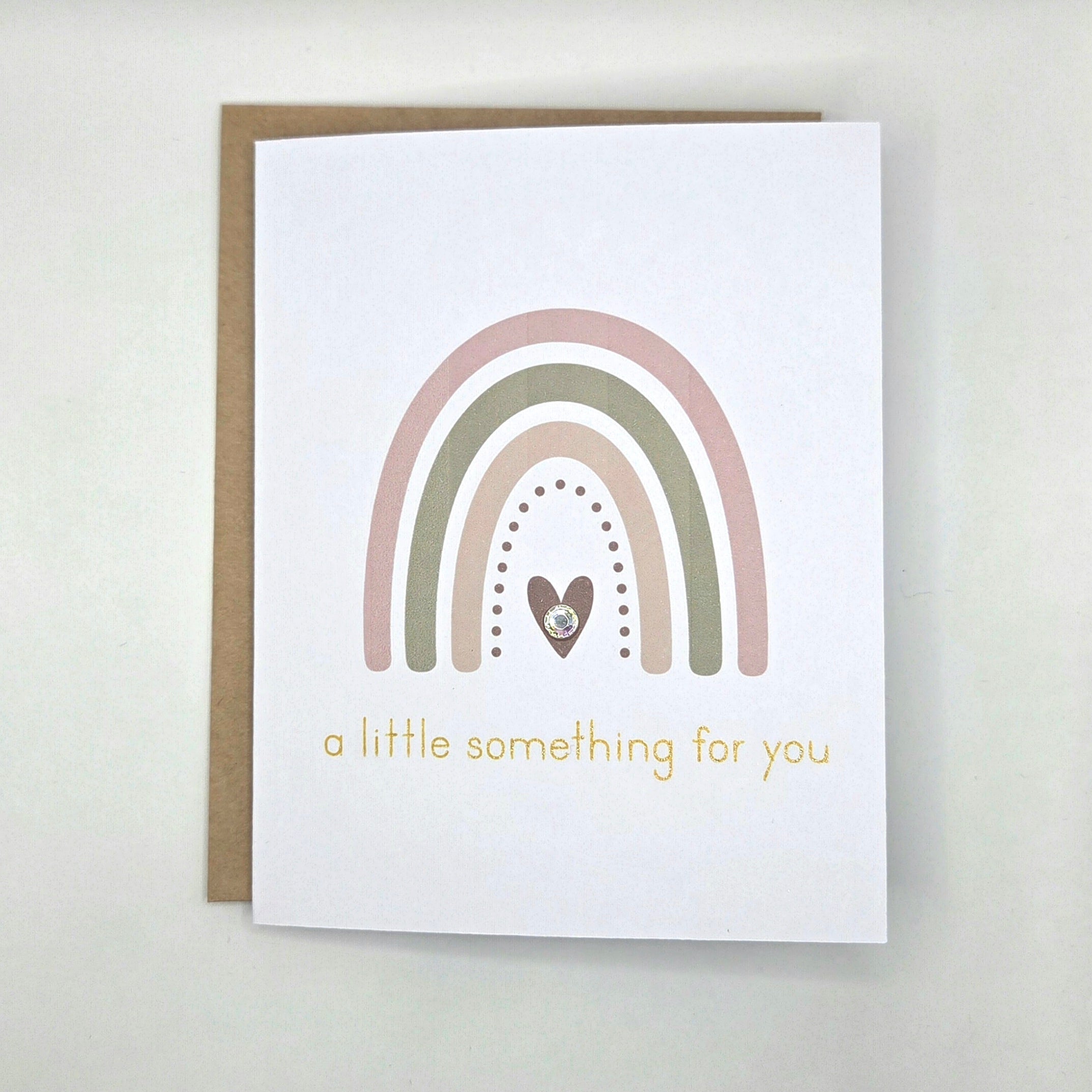Rainbow card with heart and gold text 'a little something for you'