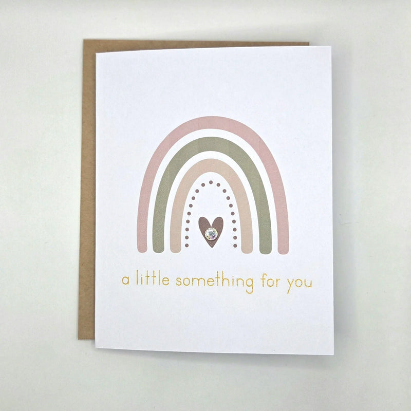Boho rainbow greeting card with heart and gold text 'a little something for you'