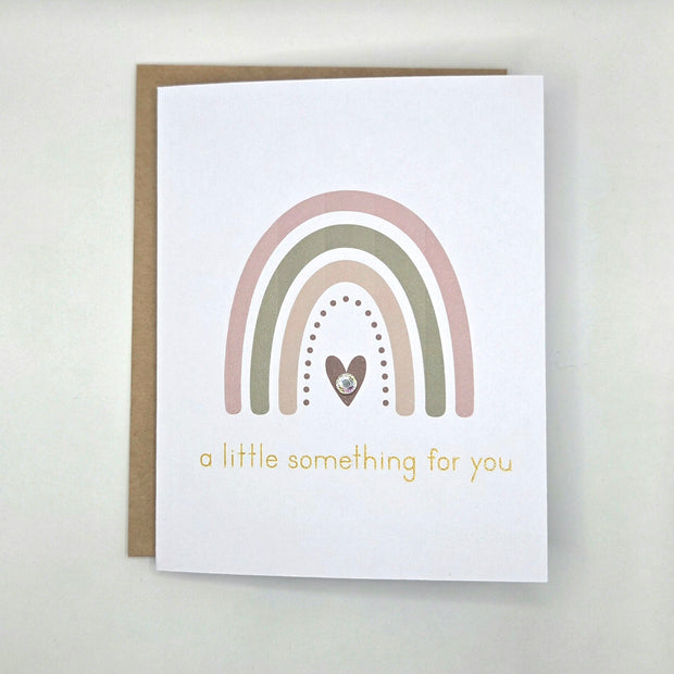 Rainbow card with heart and gold text 'a little something for you'