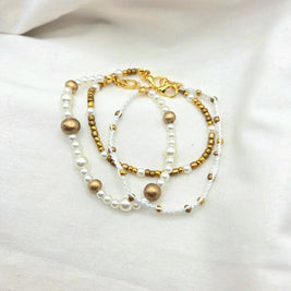 Handmade pearl and gold bead necklace with white cord, elegant and cozy accessory for everyday wear