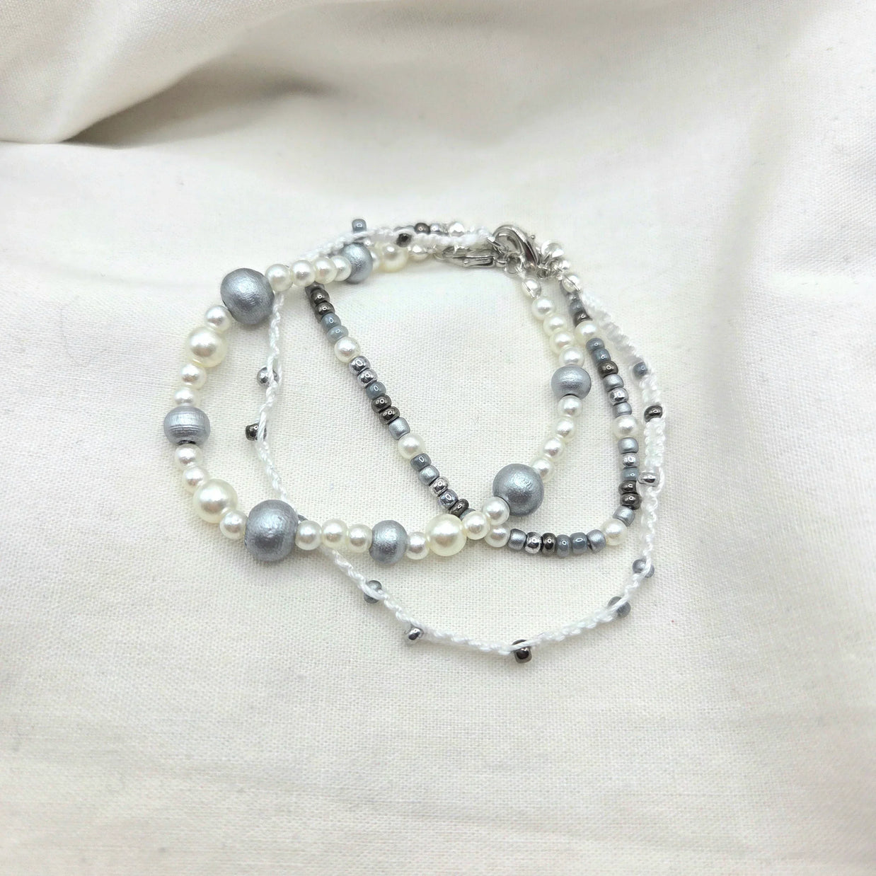 Handmade pearl and silver bead necklace with white cord, elegant and cozy accessory
