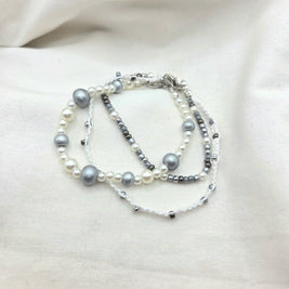 Handmade pearl and silver bead necklace with white cord, elegant and cozy accessory