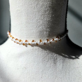 Handmade crochet choker necklace with amber beads, cozy and delicate accessory for everyday wear.