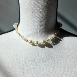 Elegant pearl necklace with gold chain on white mannequin, perfect for handmade gift ideas