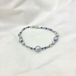 Handmade gray beaded bracelet with silver accents, perfect for cozy everyday wear