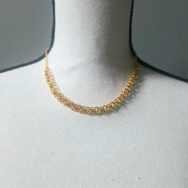 Gold chain necklace on white display bust, elegant everyday jewelry piece