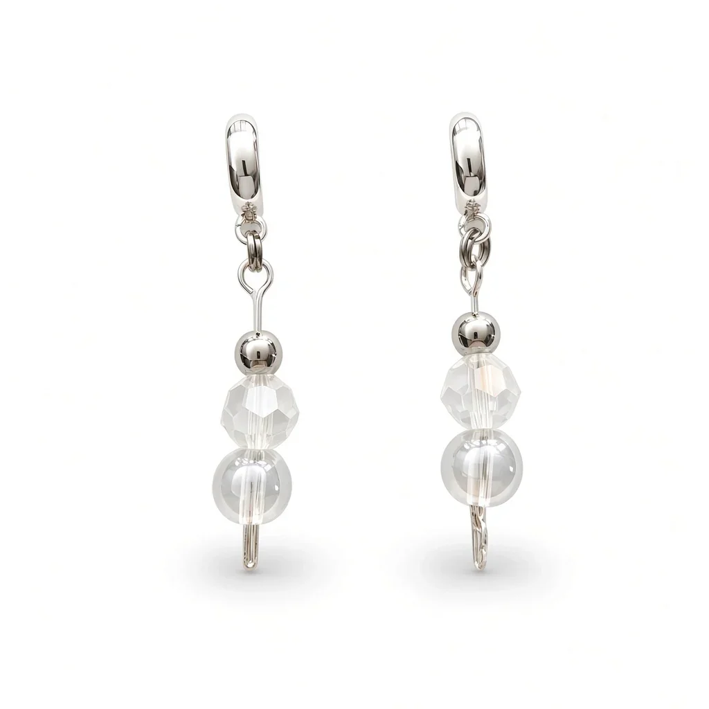 A pair of silver leverback drop earrings featuring faceted clear beads and a larger round pearl-like bead, shown on a clean white background.
