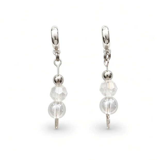 A pair of silver leverback drop earrings featuring faceted clear beads and a larger round pearl-like bead, shown on a clean white background.