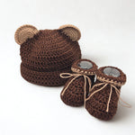 Handmade crochet bear hat and booties set, cozy baby gift with soft brown yarn and button details