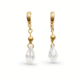 A pair of gold huggie hoop earrings with dangling chains, small gold beads, and clear faceted teardrop crystal drops, shown on a clean white background.