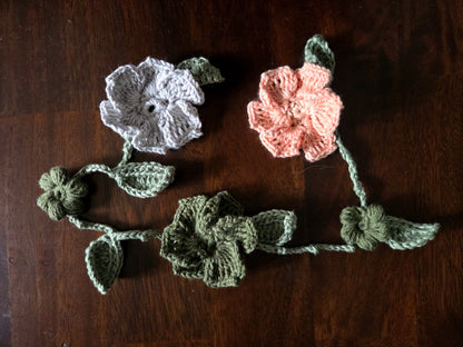crocheted flowers on a vine garland