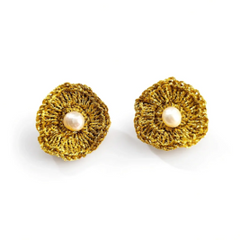 A pair of gold textured flower-shaped earrings with a central white pearl, displayed on a clean white background.