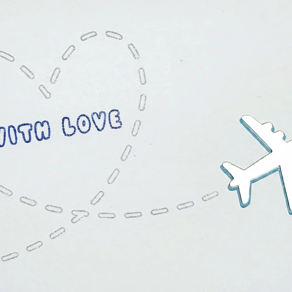 Handmade by Erika Liesel With Love greeting card featuring a shiny silver airplane and a dashed heart flight path.