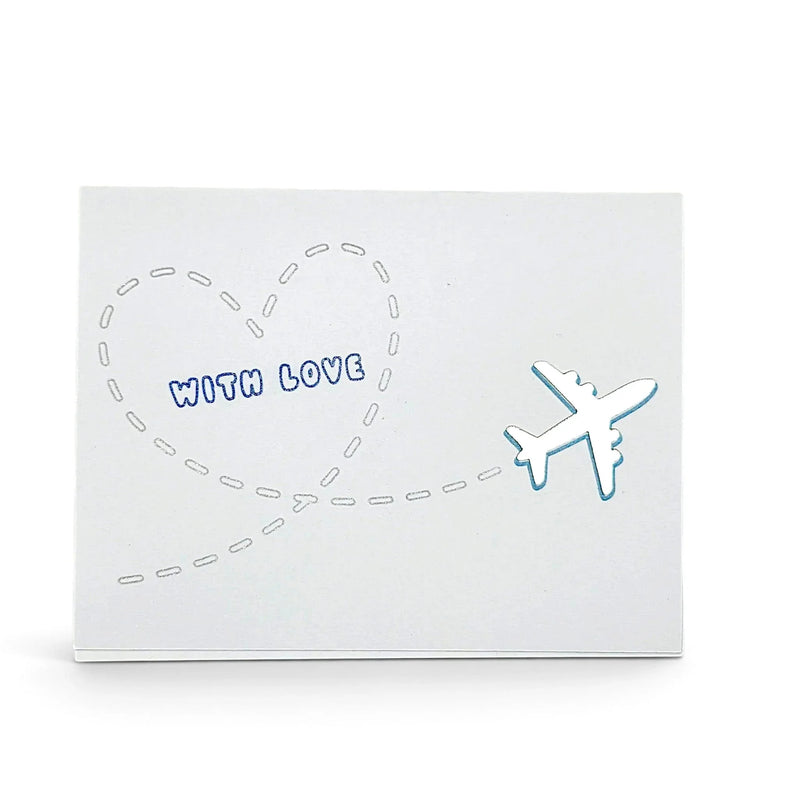 Handmade by Erika Liesel With Love card featuring a shiny airplane and heart flight path on premium cardstock