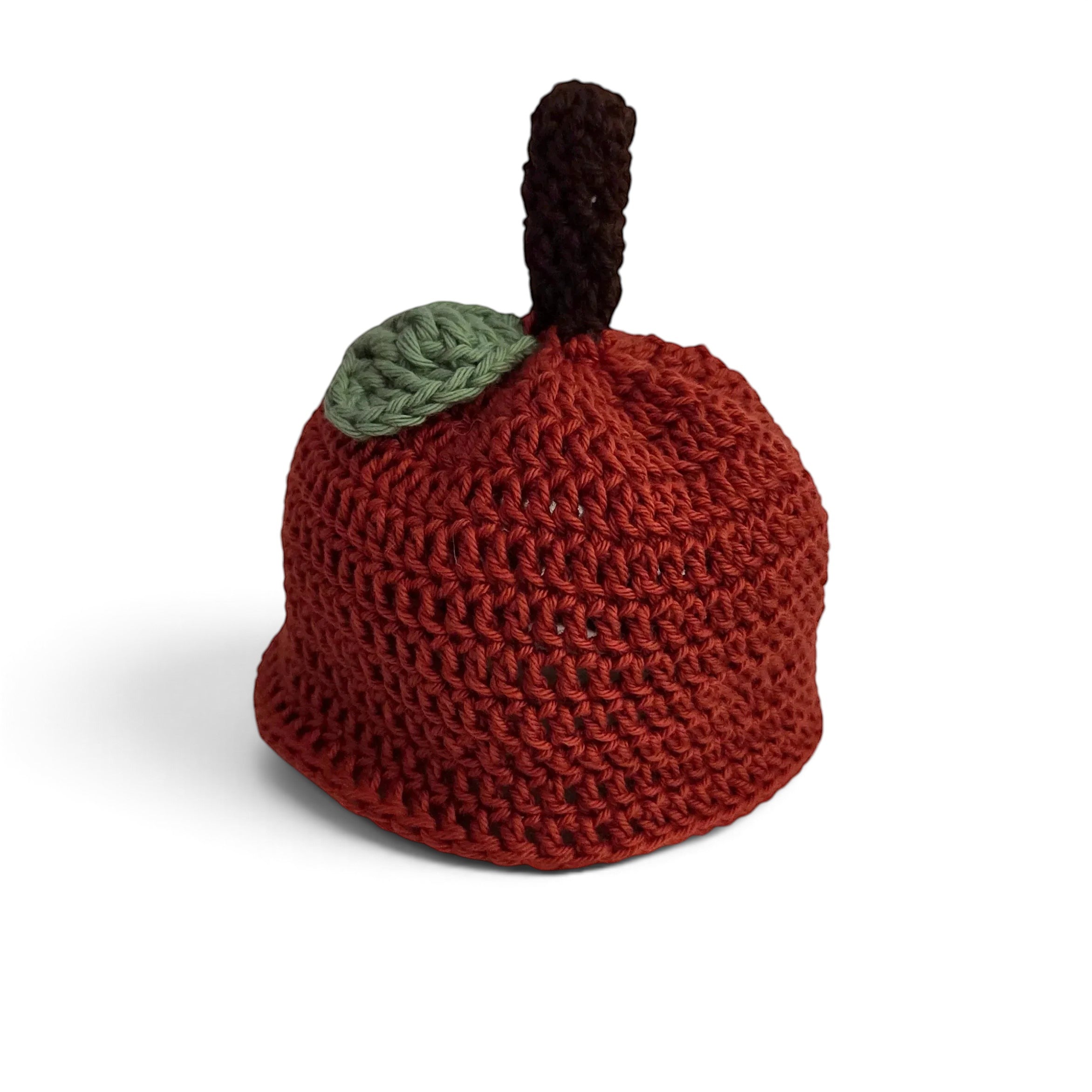 Handmade by Erika Liesel apple-shaped crochet gnome hat in red cotton with a brown stem and green leaf detail.