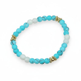 Handmade by Erika Liesel Blue Current stretch bracelet with aqua marbled glass beads, white beads, and gold accents.