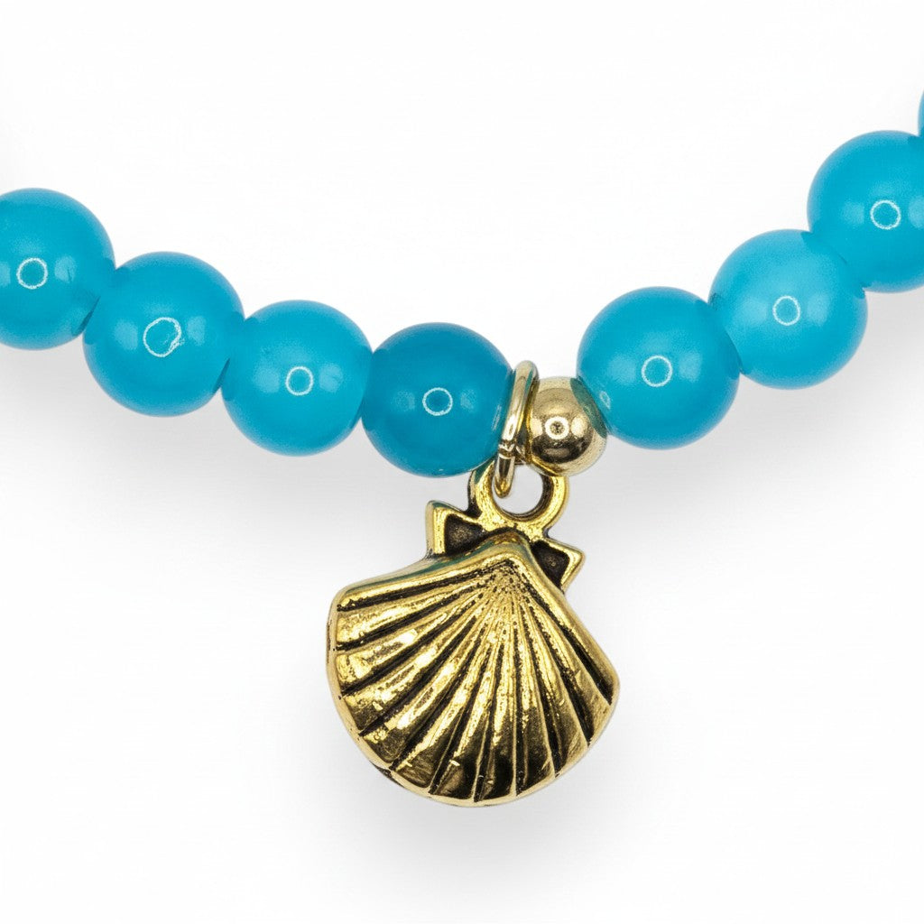 Handmade by Erika Liesel aqua glass bead stretch bracelet featuring a gold-tone seashell charm