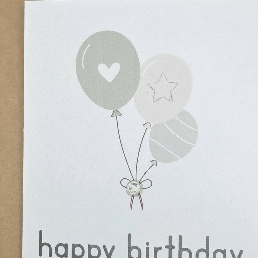 Handmade by Erika Liesel birthday card featuring neutral balloons with heart, star, and gemstone detail on white card