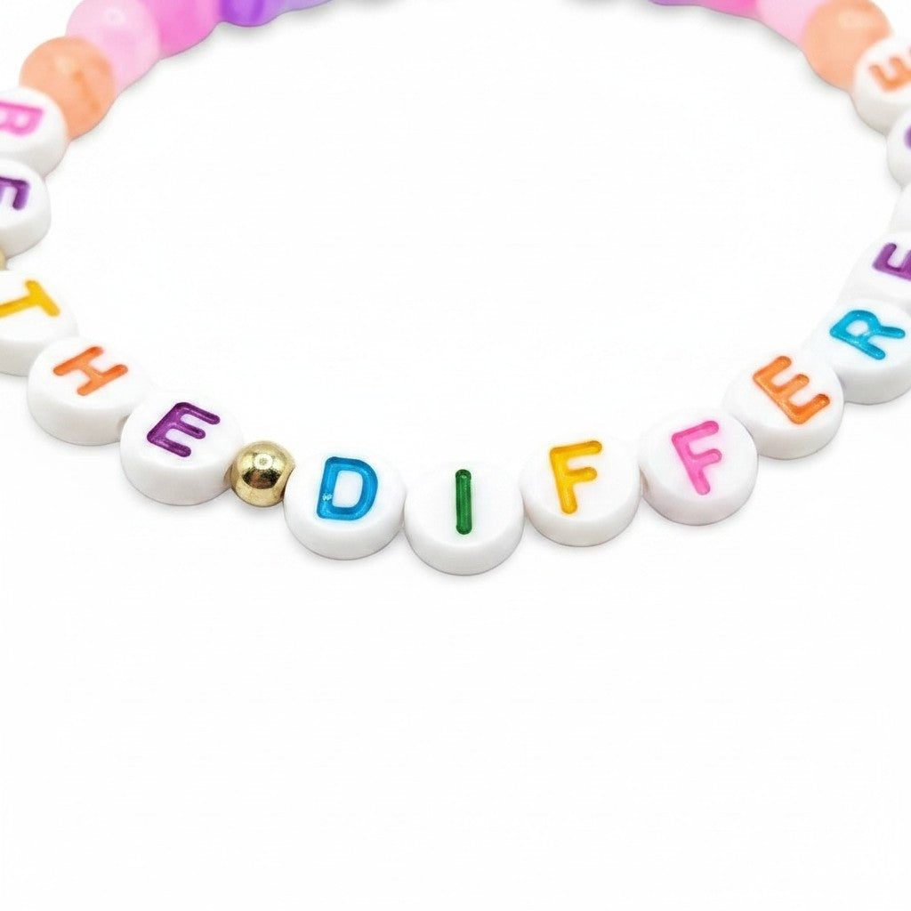 Handmade by Erika Liesel Be the Difference stretch bracelet with colorful glass beads and lettered message beads.