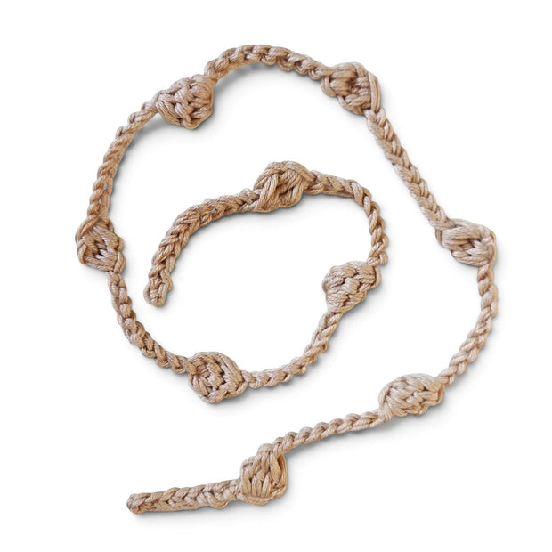 Handmade by Erika Liesel beige crochet garland with knotted texture for cozy home decor and shelf styling