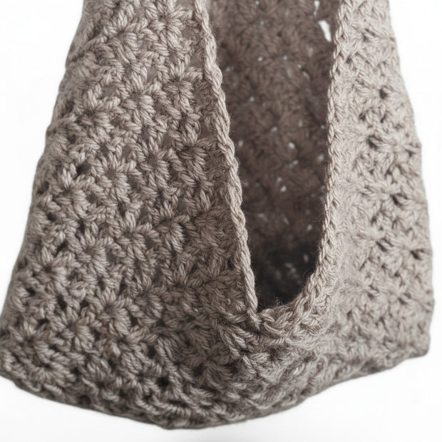 Handmade by Erika Liesel beige crochet hanging basket with a textured star stitch pattern for home storage