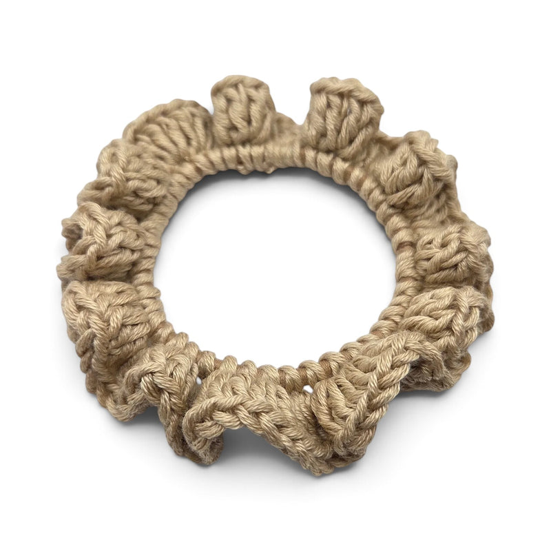 Handmade by Erika Liesel beige crochet scrunchie with textured yarn loops on a white background