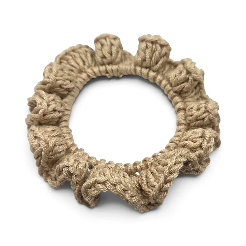 Handmade by Erika Liesel beige crochet scrunchie made from soft yarn with a durable hair tie for a secure hold