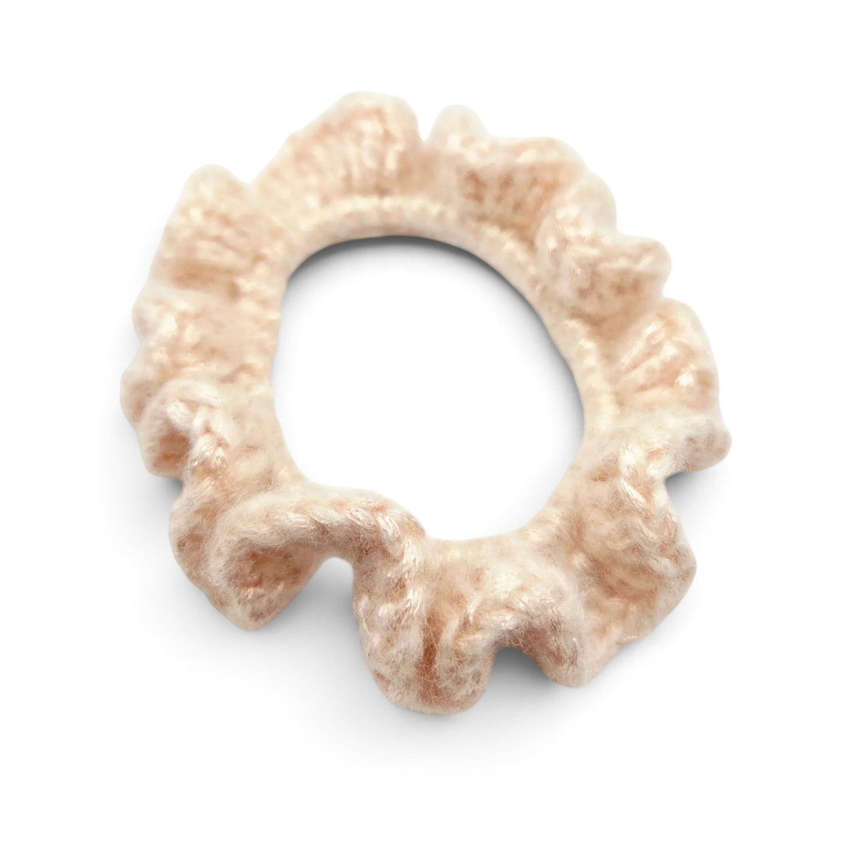 Handmade by Erika Liesel Luxe Touch crochet scrunchie in a soft beige yarn with a delicate, ruffled texture.