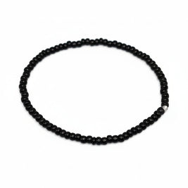 Handmade by Erika Liesel minimalist stretch bracelet featuring glossy 3mm black glass beads on a durable elastic cord.