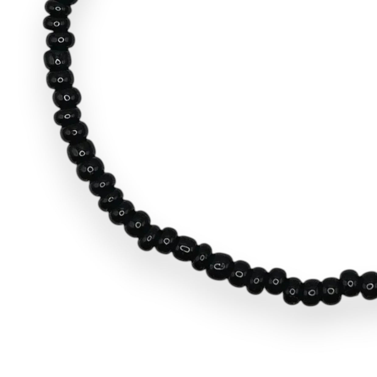 Handmade by Erika Liesel minimalist stretch bracelet featuring small glossy black glass beads on an elastic cord