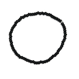 Handmade by Erika Liesel minimalist stretch bracelet featuring glossy 3mm black glass beads on a durable elastic cord.