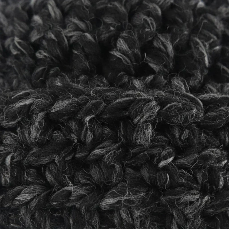Close-up of a Handmade by Erika Liesel black and grey marled crochet beanie showing the soft, textured yarn detail.