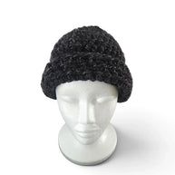 Handmade by Erika Liesel classic black crochet beanie worn cuffed on a white mannequin head