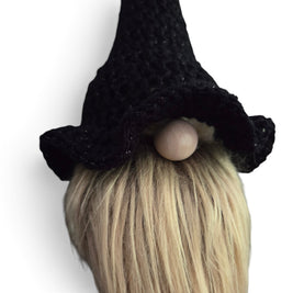 Handmade by Erika Liesel black crochet witch hat with subtle shimmer on a seasonal gnome with a blonde beard