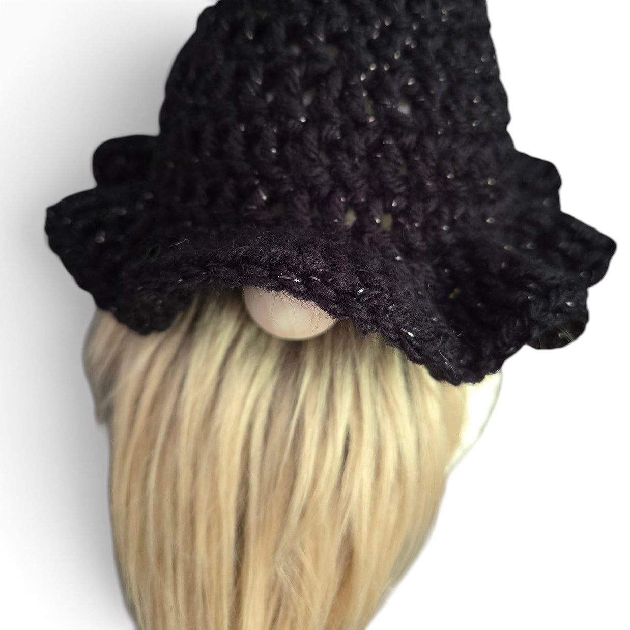 Handmade by Erika Liesel black crochet witch hat with subtle shimmer for a seasonal gnome with a blonde beard