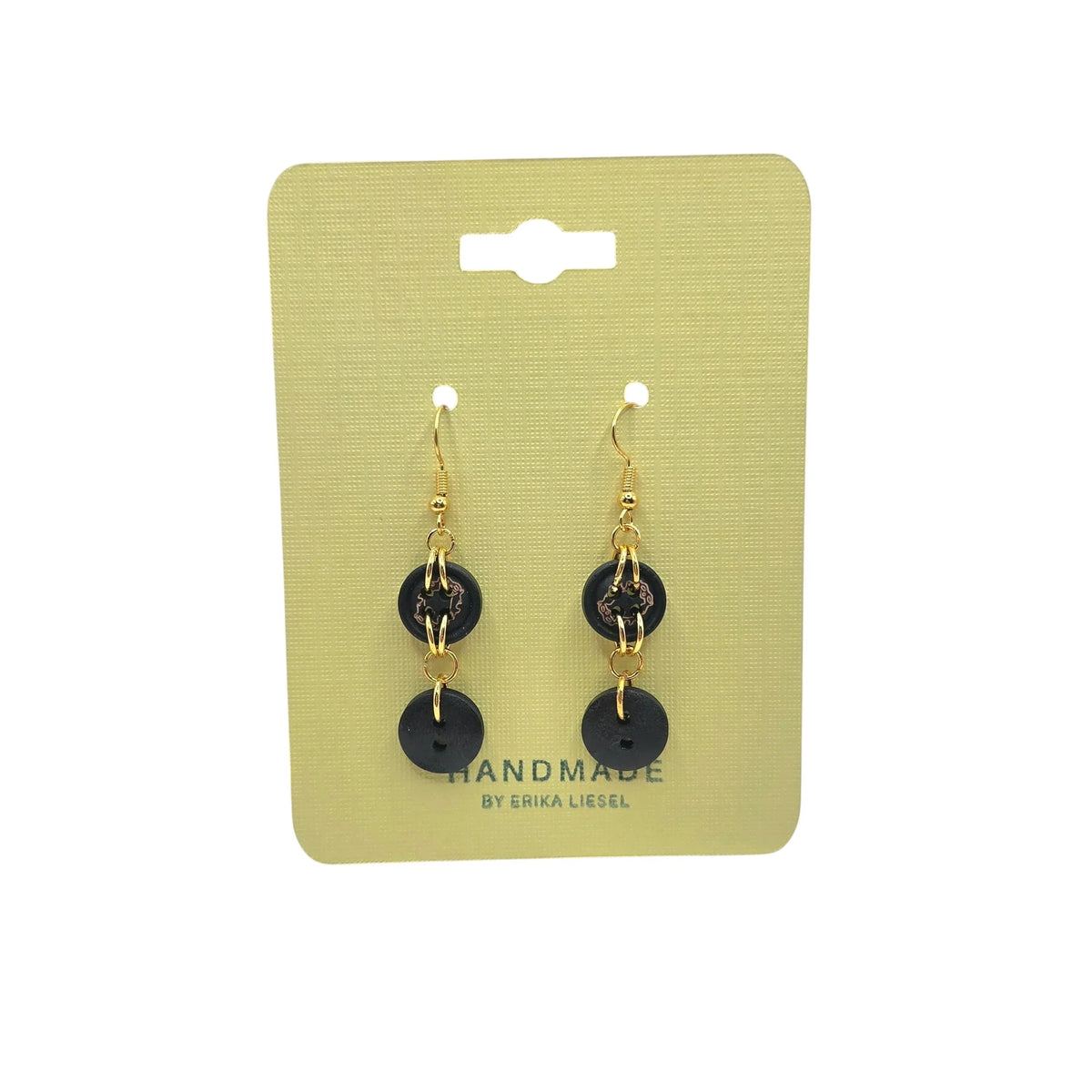 Handmade black button dangle earrings with gold hooks on yellow card, cozy crochet gift style