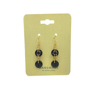 Handmade black button dangle earrings with gold hooks on yellow card, cozy crochet gift style