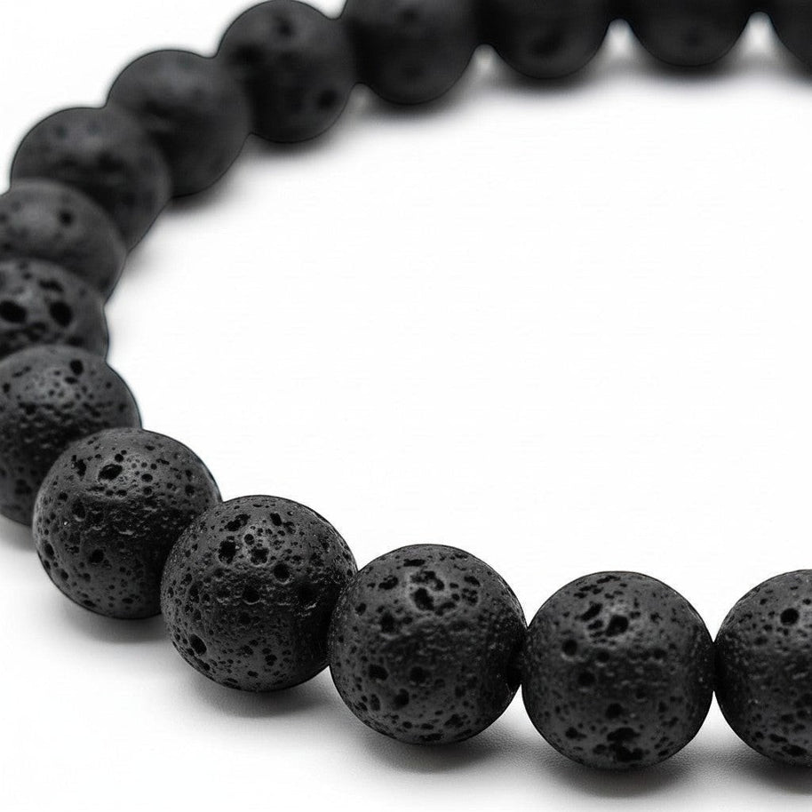 Handmade by Erika Liesel black lava stone beaded elastic bracelet with a porous, textured surface