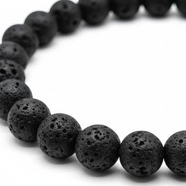 Handmade by Erika Liesel black lava stone beaded elastic bracelet with a porous, textured surface