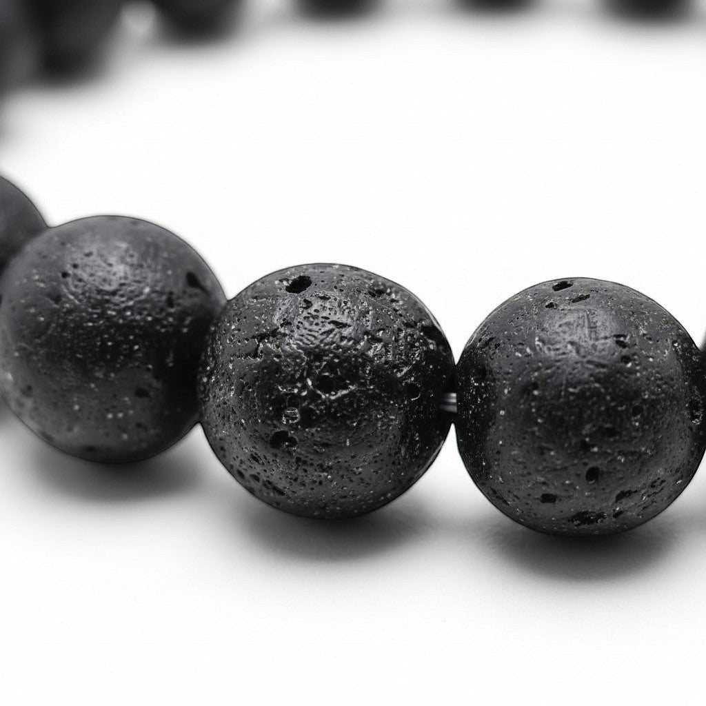 Handmade by Erika Liesel black lava stone beaded elastic bracelet with a textured, porous surface