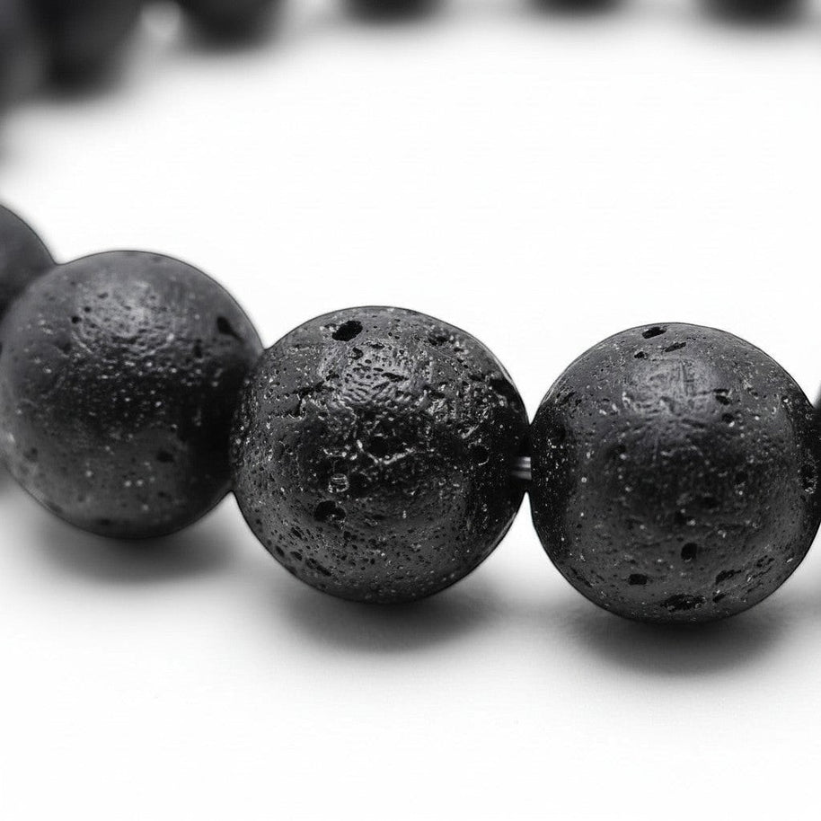 Handmade by Erika Liesel black lava stone beaded elastic bracelet with a textured, porous surface