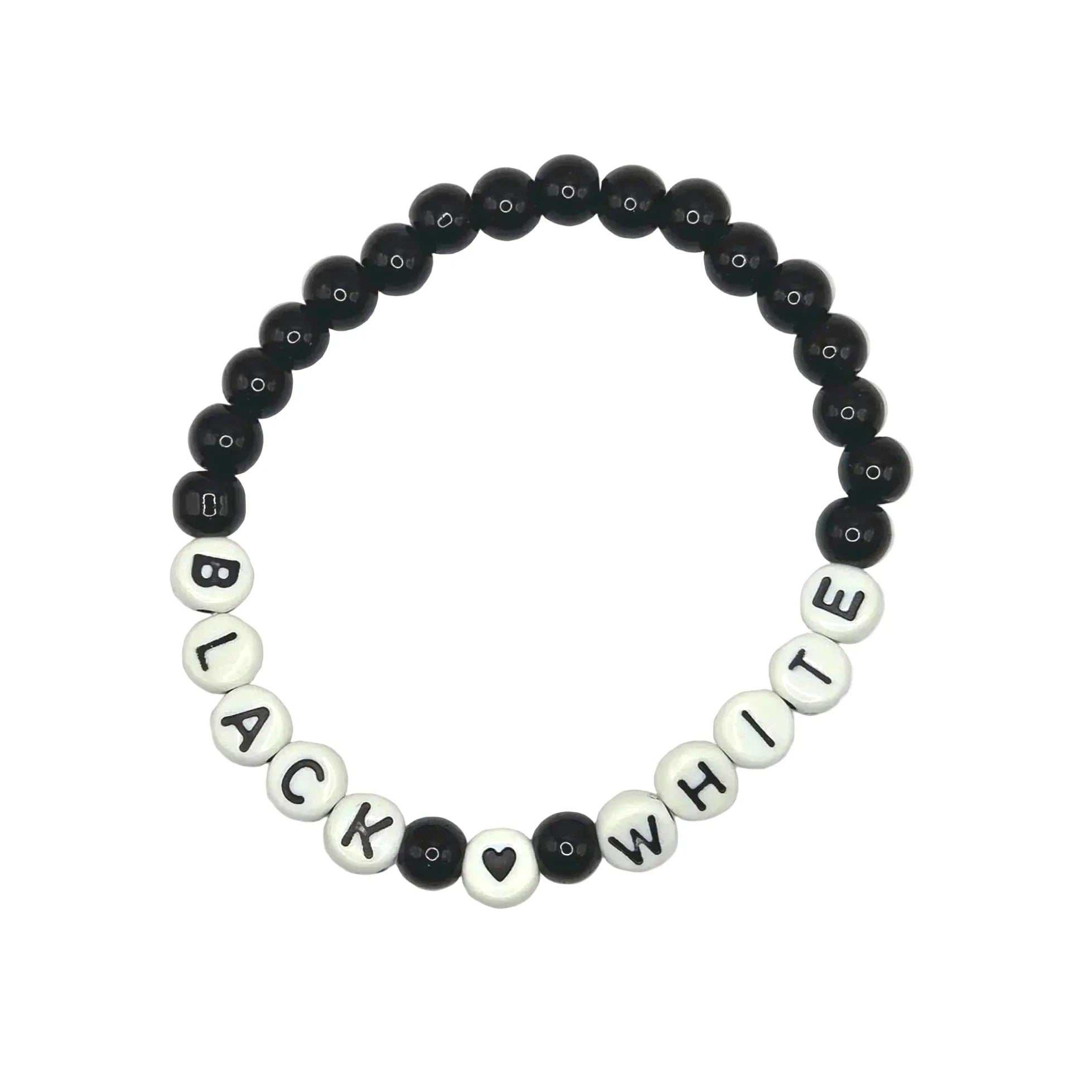 Handmade by Erika Liesel stretch bracelet featuring black glass beads and white letter beads spelling Black White