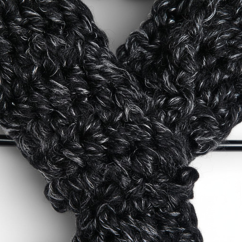 Handmade by Erika Liesel black and white marled crochet keyhole scarf with a soft, textured yarn knit design.