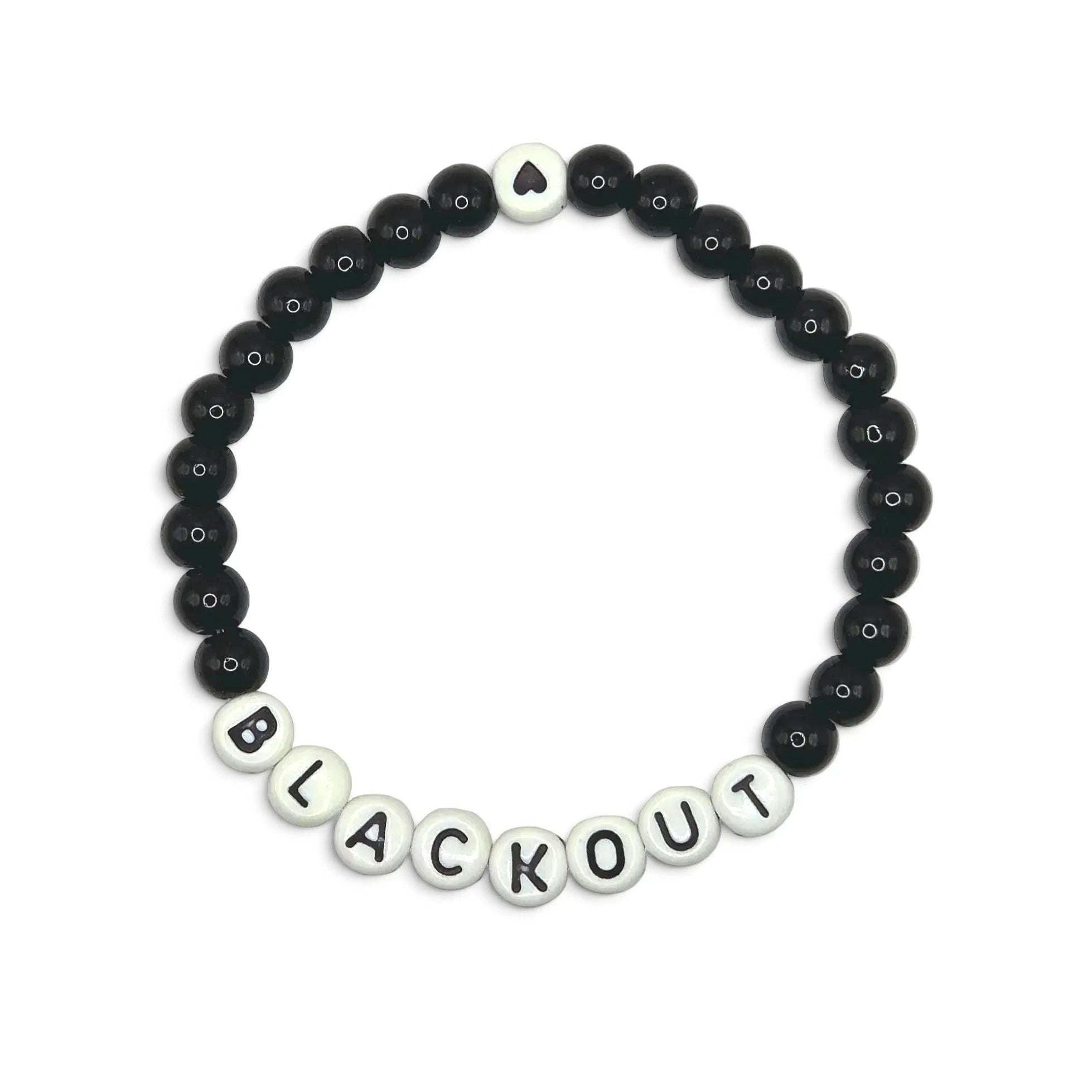 Handmade by Erika Liesel Blackout stretch bracelet with 6mm black glass beads and white letter beads on elastic cord.