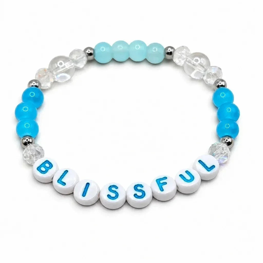 Handmade by Erika Liesel Blissful stretch bracelet with blue and clear crystal beads and sterling silver accents
